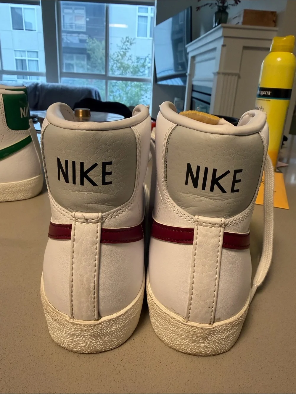 Nike Kids White High-Top Sneakers with Red Swoosh